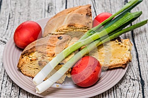 Red Easter Eggs with spring onion and sweet Istrian easter bread