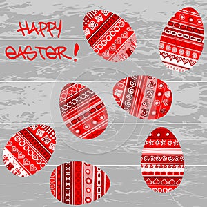Red Easter eggs on wooden background