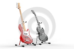 Red electric bass and black guitar on stands