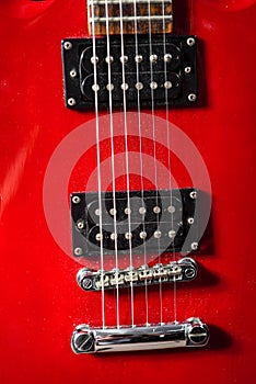 Red electric guitar. Taken in close-up in detail