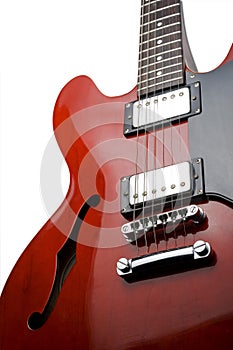 Red electric guitar upright