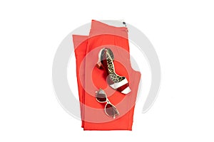 Red elegant woman trousers, an matching elegant female shoe and sun glasses