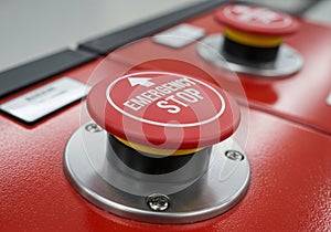Red emergency stop button on control panel