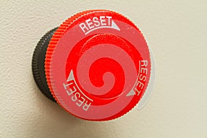 Red emergency stop and reset botton