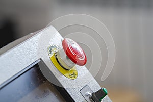 Red emergency stop switch reset button on machinery industry