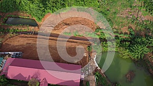 Red empty land and buildings top view