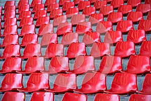 Red empty stadium seats in arena