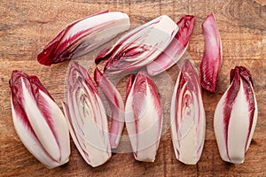 Red endive slices on wooden background. Top view