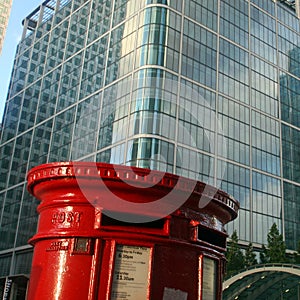 Red English postbox on architectural background