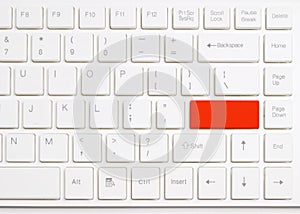 Red enter button on white computer keyboard