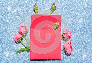 Red Envelope Decorated with Roses on a Glittering Silver Background