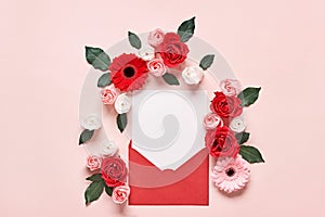 Red envelope with Romantic love letter mockup and flowers on pink background