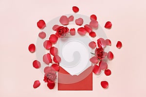 Red envelope with Romantic love letter mockup, rose flowers and petals on pink background