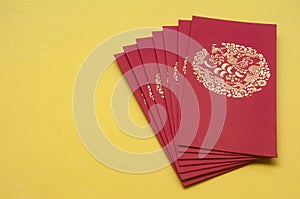 Red envelope on yellow cover background. Monetary gift given during special occasions such as Chinese New Year, birthday