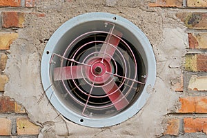 Red exhaust fan on the wall