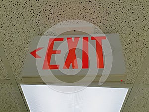 Red exit sign on ceiling photo