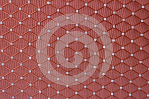 Red fabric background with tiled decor - textile texture