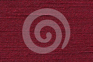 Red fabric of cloth texture background. Detail of textile material close-up