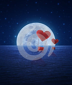 Red fabric heart air balloon on fantasy sea sky and moon,