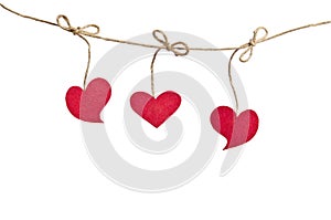 Red fabric hearts hanging on the clothesline