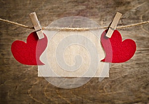 Red fabric hearts with sheet of paper