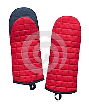 Red fabric quilted oven mitts with silicone inserts isolated