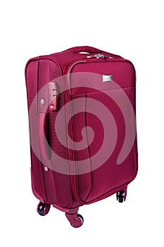 Red fabric suitcase isolated on white background. Travel conception