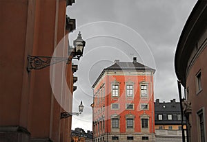 Red facade of palace w windows, Stockholm Sweden