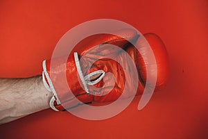 red faded boxing gloves on red background