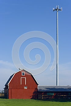 Red farm with a cell tower.