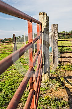 Red Farm Gate and Wooden Post