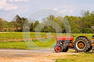 Red farm tractor near field