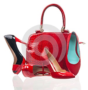 Red fashion women shoes and handbag on white