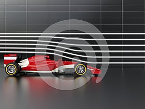 Red fast formula racing car in wind tunnel