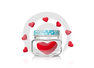 Red felt heart in glass jar with blue poka dot lid