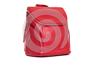 Red female backpack on a white background
