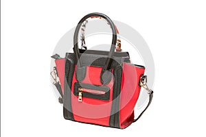 Red female bag with black handles, decoration on the handle, isolated on white background