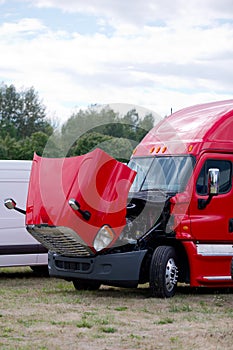 Red fensy commercial semi truck rig with open hood