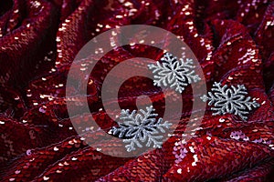 Red festive background with glitter and silver decorations for Christmas tree for lettering and greeting card