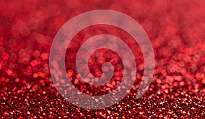 Red festive Christmas background. Abstract shimmering bright background with bokeh defocused