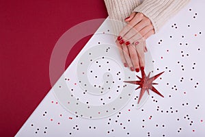 Red festive female manicure. Flat lay style.