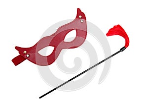 Red fetish mask and a whip