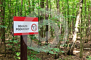 Red Fire access, Fire road signpost Polish: Dojazd Pozarowy, Droga Pozarowa in Puszcza Marianska Nature Reserve photo