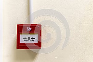 A red fire alarm button inside hospital or factory industry zone.Fire alarm use for emergency warning purpose.