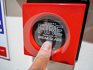 A red fire alarm MCP or manual call point button.