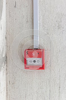 Red Fire Button on Concrete Wall