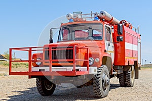 Red fire engine for extinguishing natural steppe or forest fires in the national reserve. The concept: fire-fighting special equip