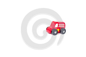 Red fire engine toy isolated over a white background