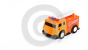 Red fire engine toy isolated over a white background