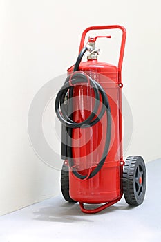 Red fire extinguisher ready in case of emergency fire